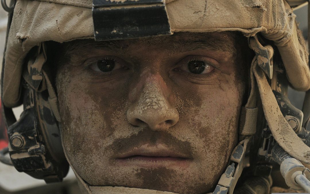 photo of US servicemember in uniform, close-up showing face only, covered with dust Photo from: https://commons.wikimedia.org/wiki/File:Defense.gov_News_Photo_120702-A-DL064-206_-_U.S._Army_Sgt._Tim_Martin_s_face_shows_the_effects_of_the_heat_and_the_dust_as_he_returns_to_Forward_Operating_Base_Spin_Boldak_Afghanistan_after.jpg