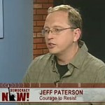 Screenshot of Jeff Paterson (courage to resist) appearing on Democracy Now